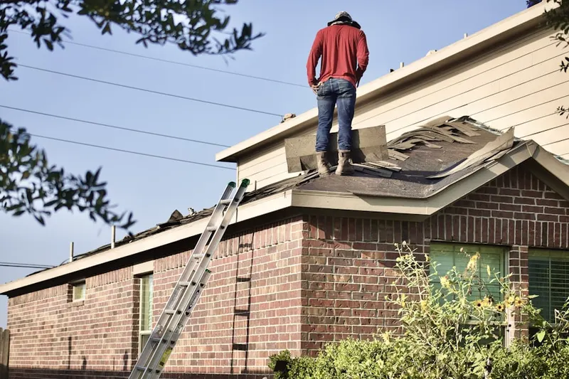 Professional roofer working on a residential roof in Villa of Flair Skippack Village